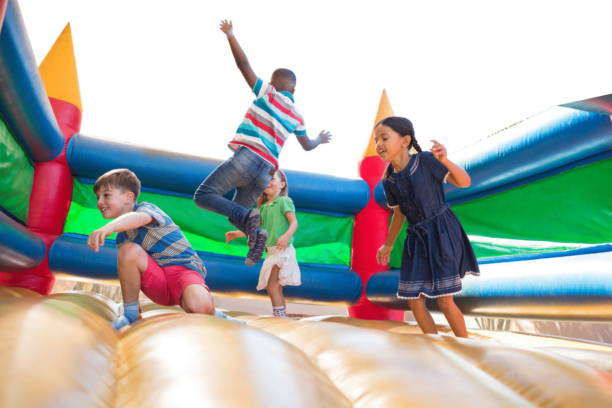 Kids playing bounce house games during a birthday party