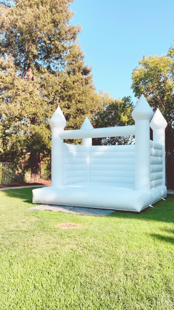 White bounce house rental in Orange County.