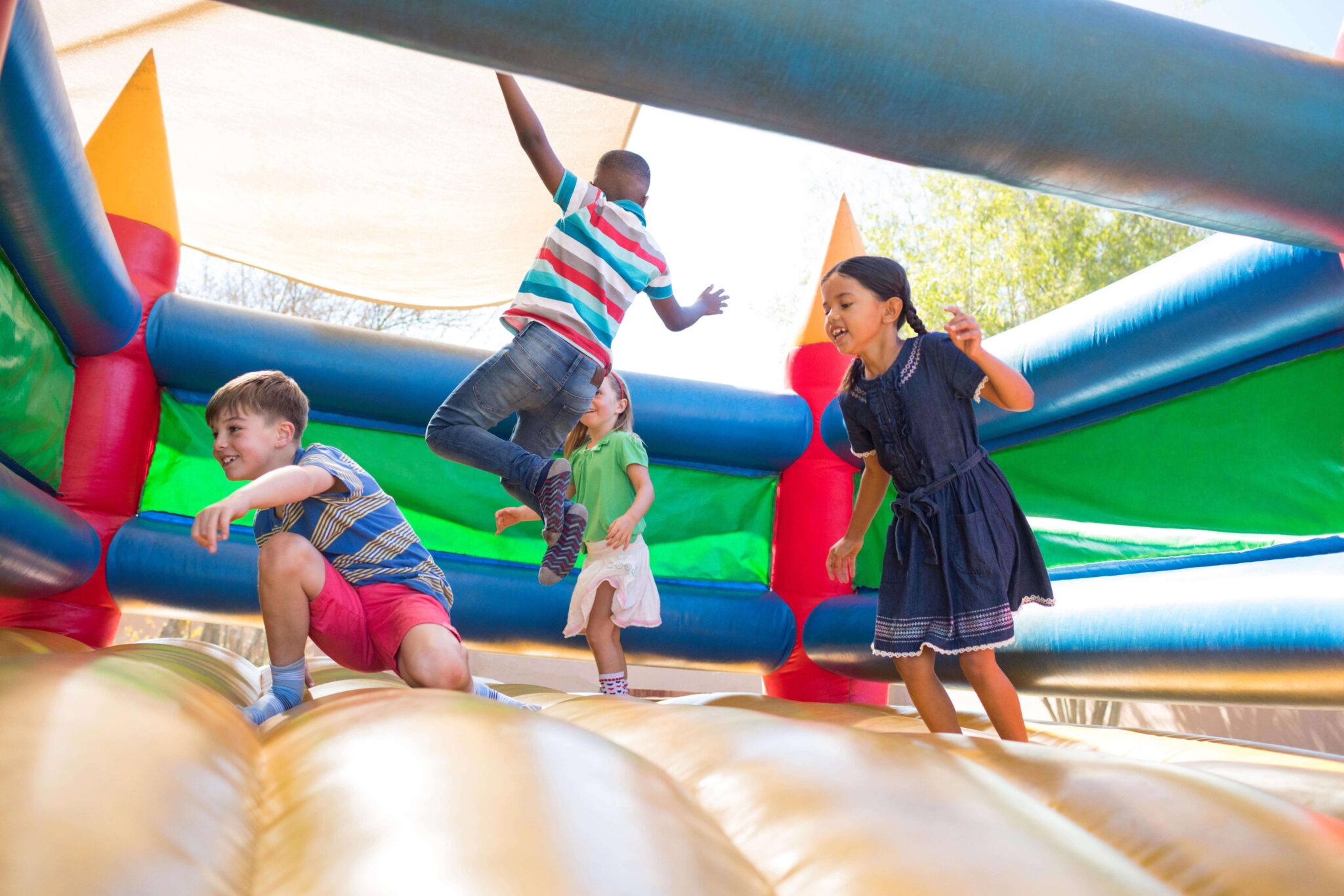 Young children playing in a bounce house